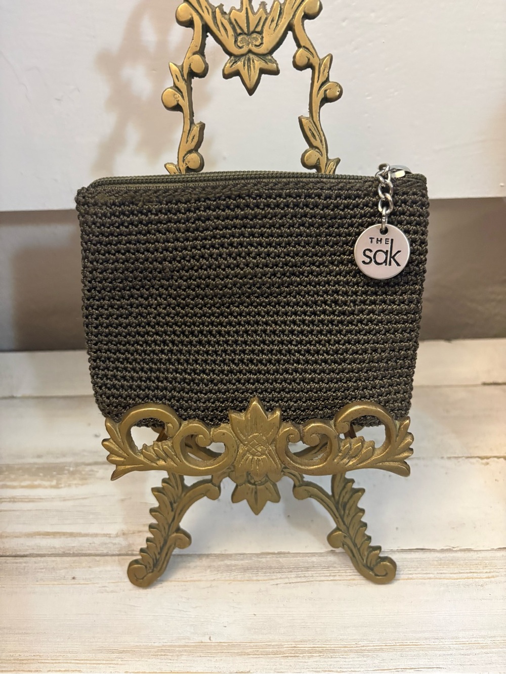 The Sak Olive Crochet Zip Pouch with Logo Charm